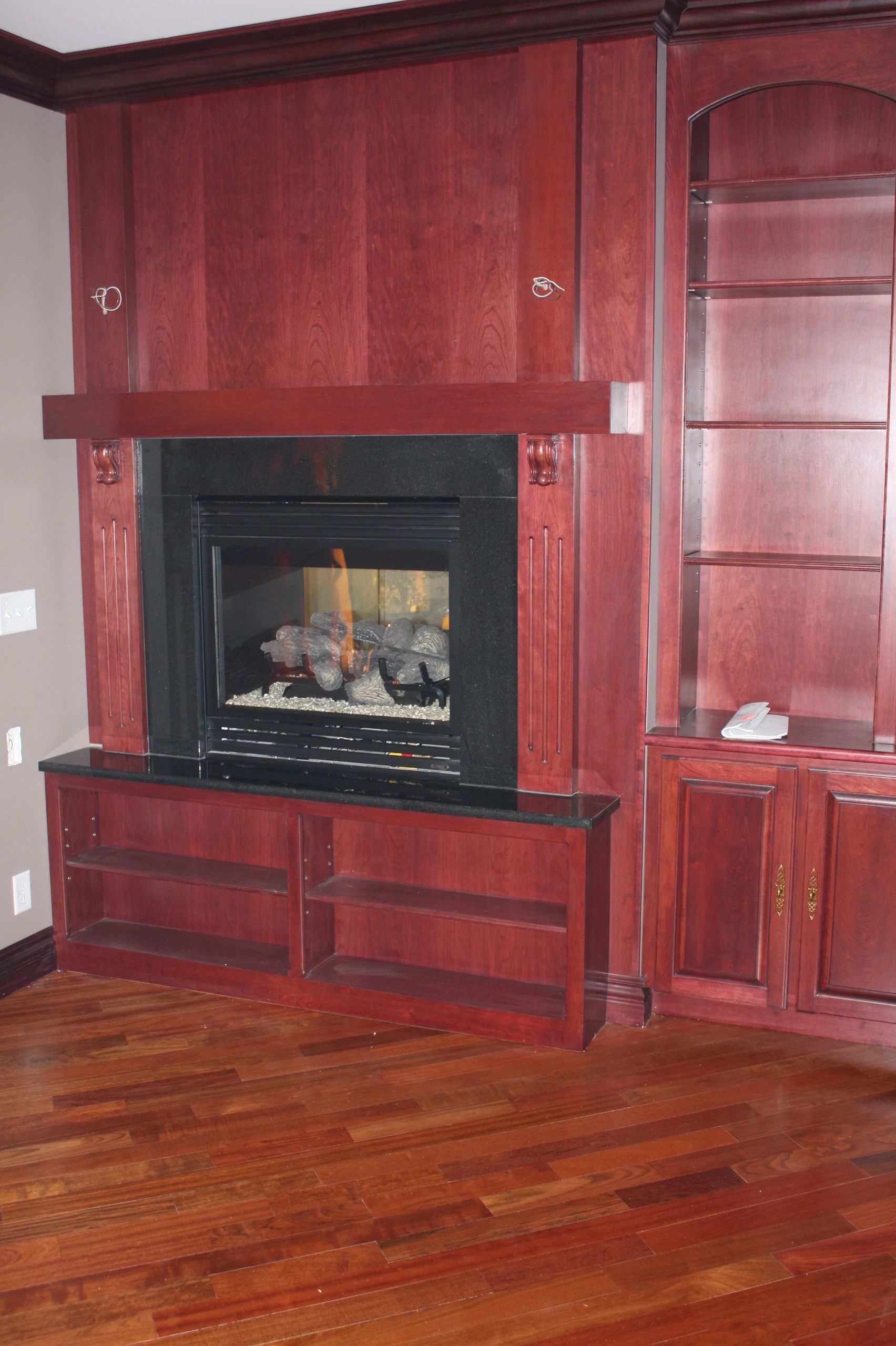 Red wooden kitchen cabinet with built-in oven